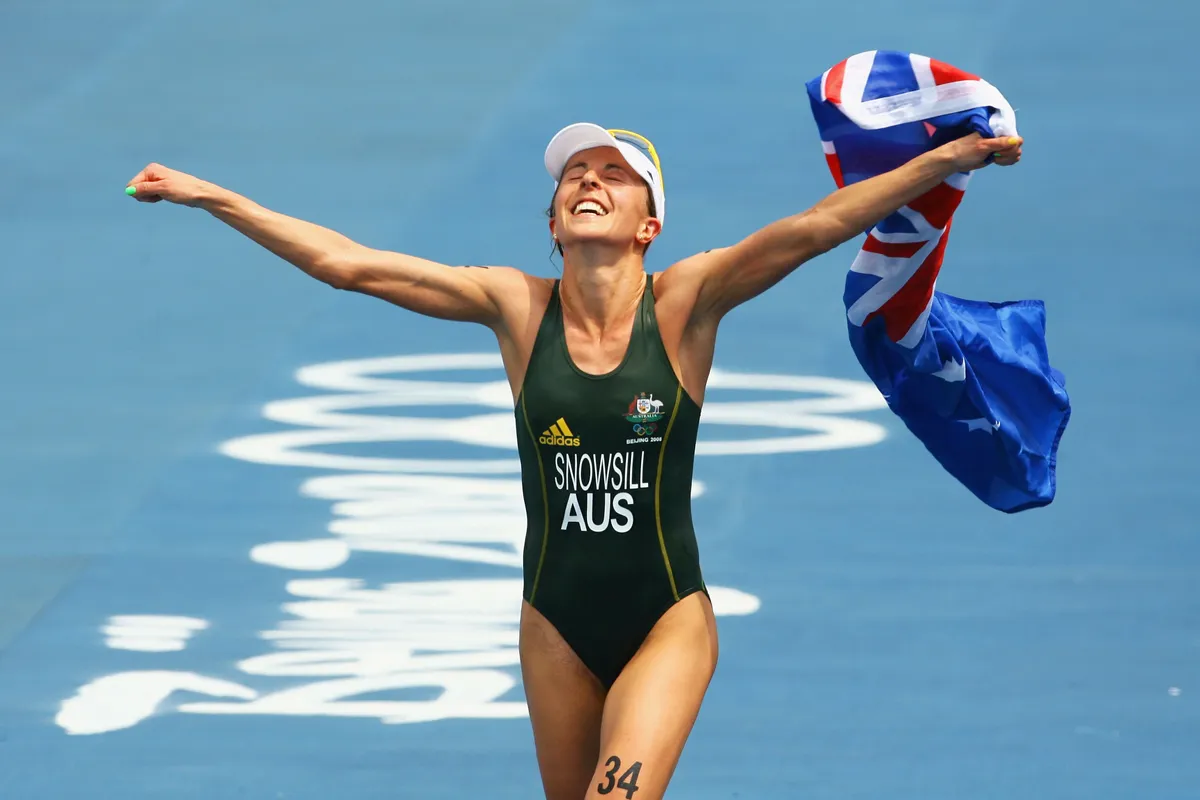 BEIJING - AUGUST 18: Emma Snowsill of Australia celebrates after taking the gold medal in the women's triathlon event at the Triathlon Venue on Day 10 of the Beijing 2008 Olympic Games on August 18, 2008 in Beijing, China. (Photo by Adam Pretty/Getty Images)