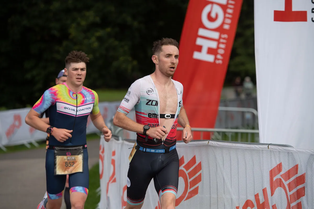Two male triathletes racing Outlaw X's Thoresby Park