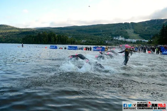 Female pros diving into the water at Ironman 70.3 World Championship 2014 in Mont Tremblant