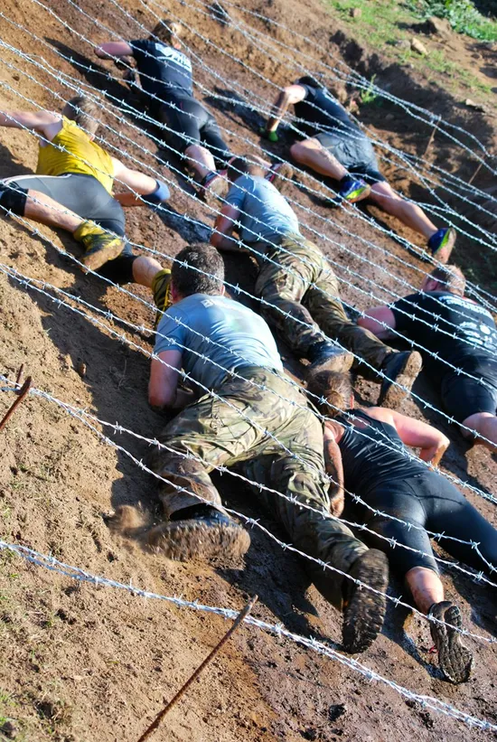 Athletes crawl under barbed wire at Tuff Enuff 2014