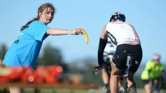 Athletes receiving bananas at Ironman New Zealand