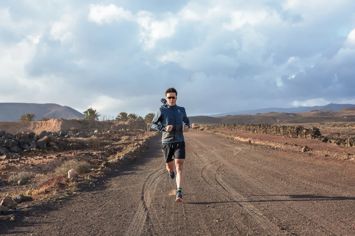 Javier Gomez running on dirt road