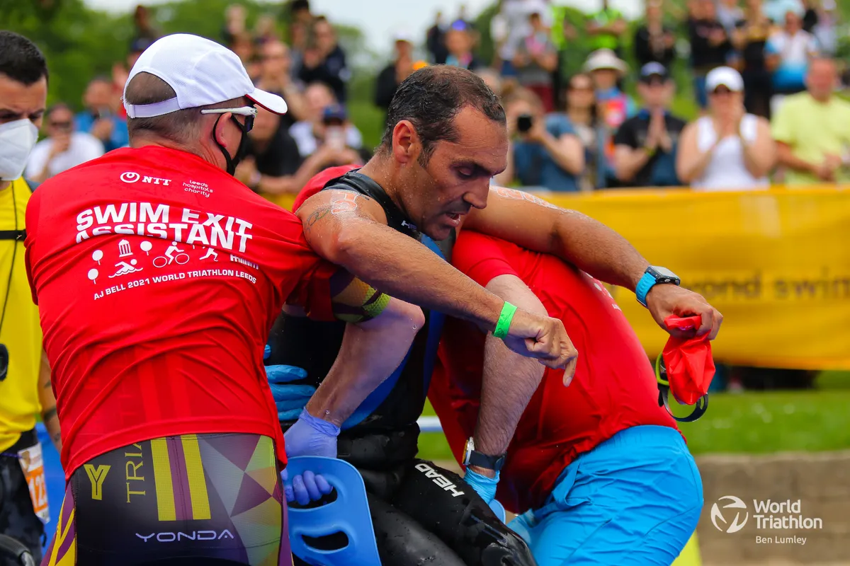 A paratriathlete is helped out the swim at Leeds paratriathlon