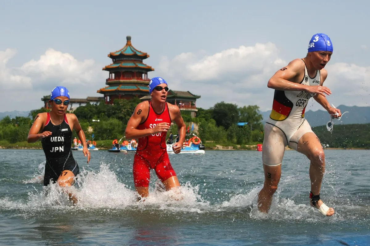A young Spirig wades out the water at the 2008 Beijing Olympics Games / Getty Images