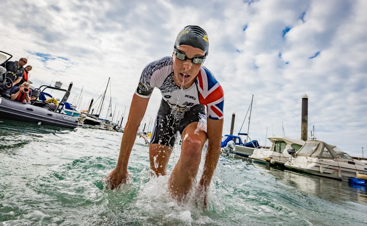 Jess Learmonth emerges from the water in first place at the 2021 Jersey Super League Triathlon
