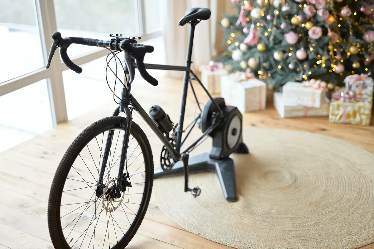 Indoor cycling by a Christmas tree