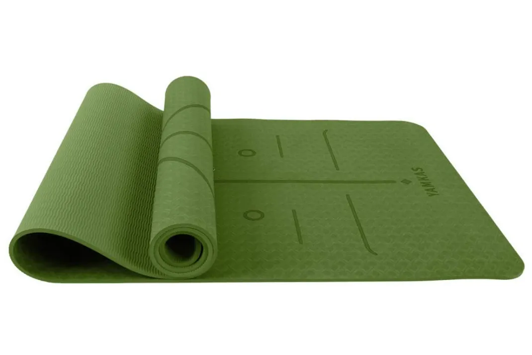 Green yoga mat with alignment lines
