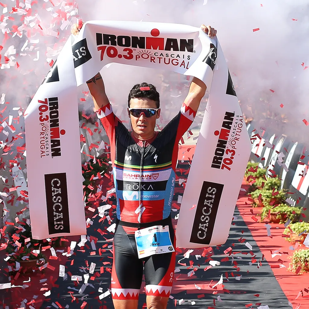 Javier Gomez crosses the finish line and wins Ironman 70.3 Cascais