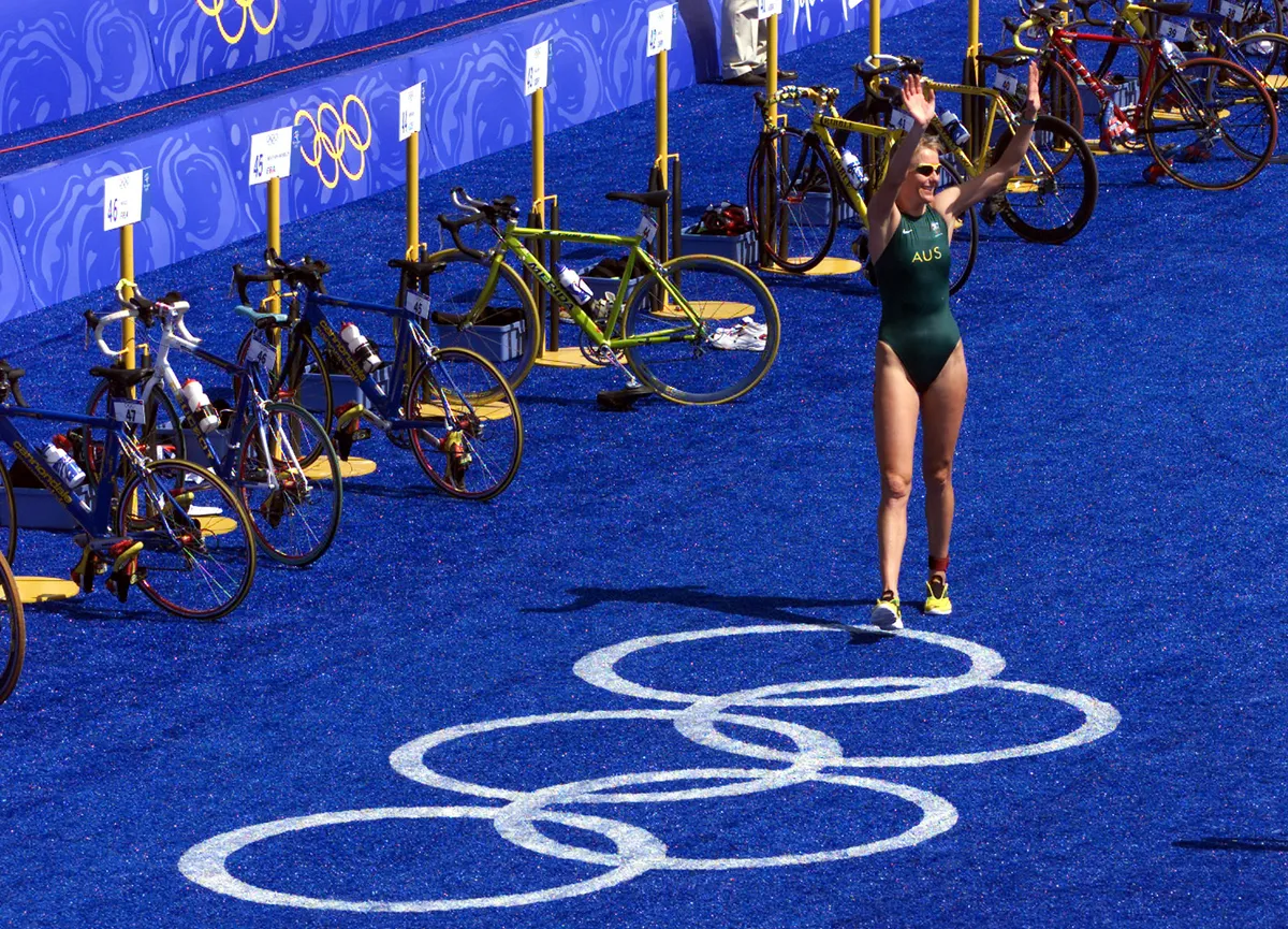 16 Sep 2000: Michellie Jones of Australia waves to the crowd after winning the silver in the Women's Triathlon during the Sydney 2000 Olympic Games, held at the Sydney Opera House Forecourt in Sydney, Australia. DIGITAL IMAGE Mandatory Credit: Jamie Squire/ALLSPORT