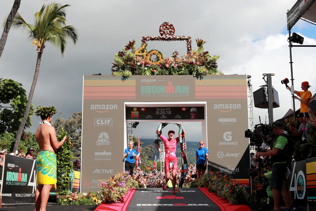 KAILUA KONA, HI - OCTOBER 13: Daniela Ryf of Switzerland celebrates after setting the course record of 8:26:16 to win the IRONMAN World Championships brought to you by Amazon on October 13, 2018 in Kailua Kona, Hawaii. (Photo by Al Bello/Getty Images for IRONMAN)
