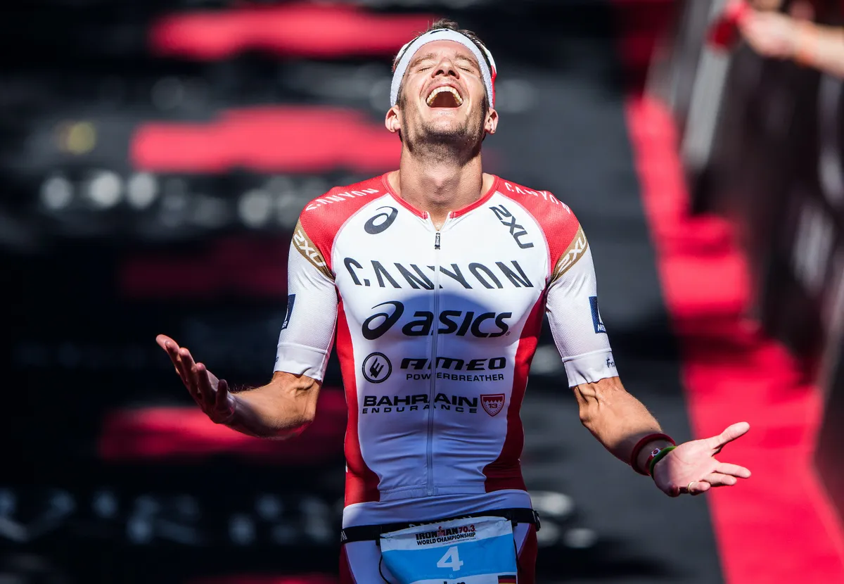 Jan Frodeno celebrates after winning the Ironman 70.3 World Championships in 2015