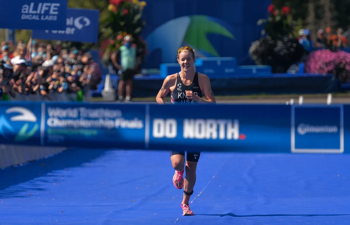 Taylor Knibb runs to the finish line at the World Triathlon Championship Finals in Edmonton