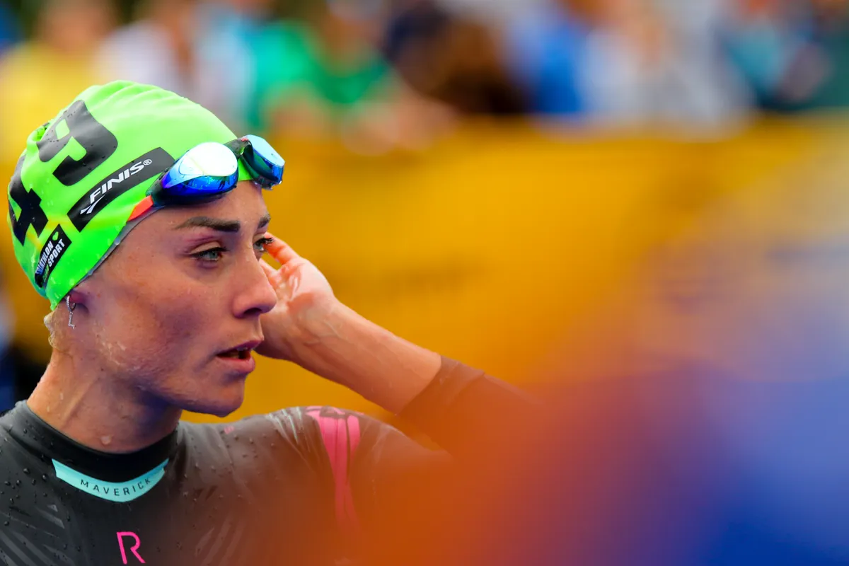 Lucy Barclay adjusts swim hat before a race