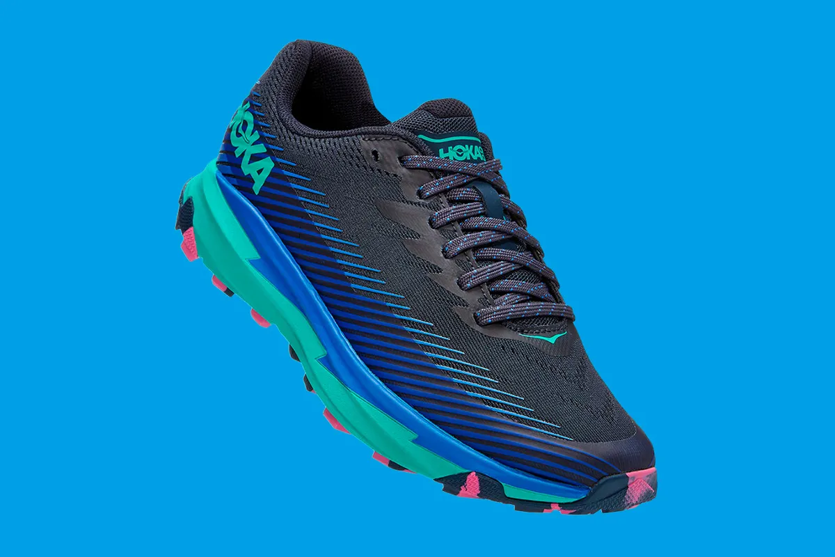 Hoka Torrent 2 run shoes on a blue background
