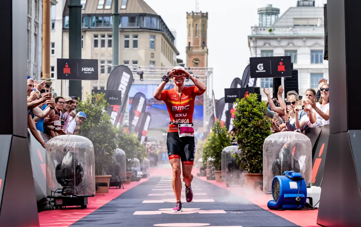 Chelsea Sodaro of the United States celebrates second place at Ironman Hamburg 2022
