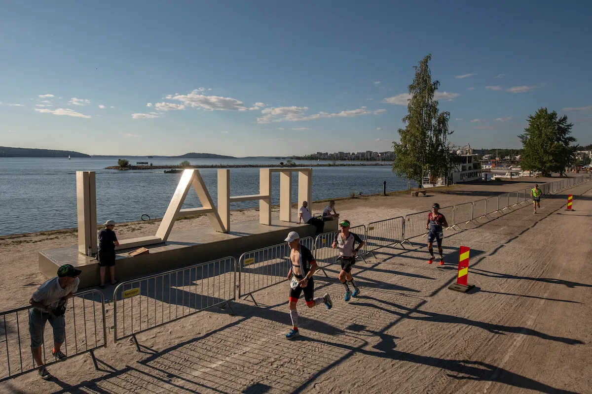 Athletes run past the popular 'LAHTI' letters photo spot on the run leg of the 2021 Ironman 70.3 Lahti, Finland