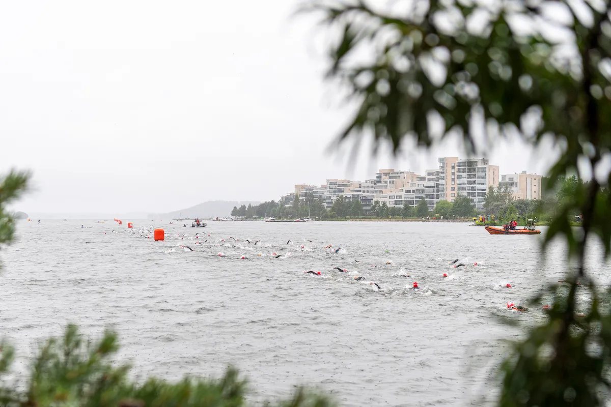 Athletes compete during the swim leg of the 2023 Ironman 70.3 Lahti, Finland, in Lake Vesijärvi