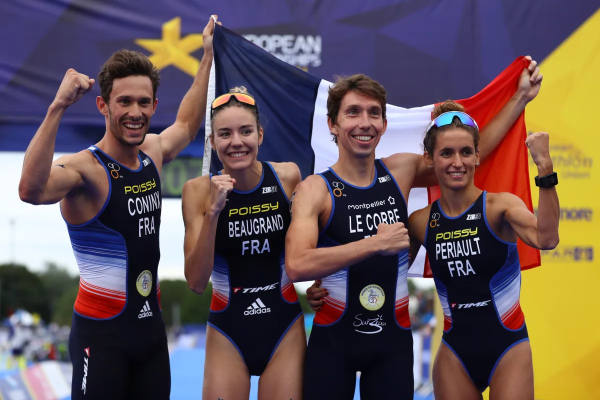 L-R: Dorian Coninx, Cassandre Beaugrand, Pierre Le Corre and Leonie Periault celebrate on the podium after winning the 2018 European Championships Mixed Team Relay event