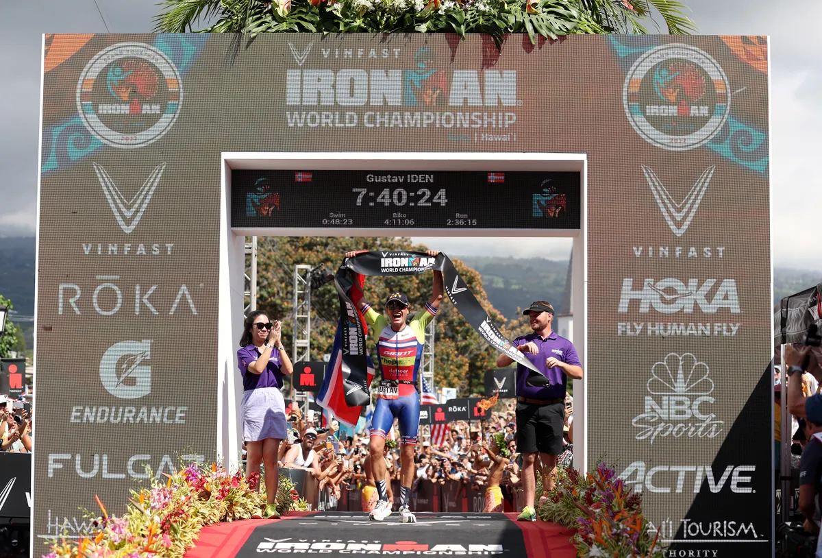 KAILUA KONA, HAWAII - OCTOBER 08: Gustav Iden of Norway celebrates after winning the IRONMAN World Championships on October 08, 2022 in Kailua Kona, Hawaii. (Photo by Ezra Shaw/Getty Images for IRONMAN)