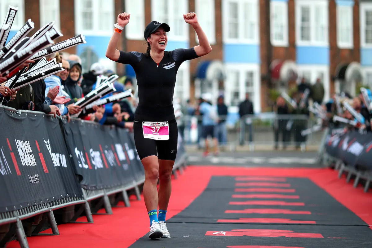 WEYMOUTH, ENGLAND - SEPTEMBER 23: India Lee of Great Britain celebrates winning the womens race during IRONMAN 70.3 Weymouth on September 23, 2018 in Weymouth, England. (Photo by Charlie Crowhurst/Getty Images for IRONMAN)