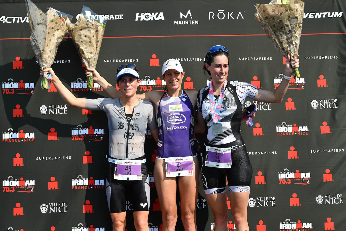 NICE, FRANCE - SEPTEMBER 12: (L-R) Lena Berlinger of Germany (2nd), Nicola Spirig of Switzerland (1st) and India Lee of Great Britain (3rd) cheer after competing in the Supersapiens IRONMAN 70.3 Nice on September 12, 2021 in Nice, France. (Photo by Alexander Koerner/Getty Images for IRONMAN)