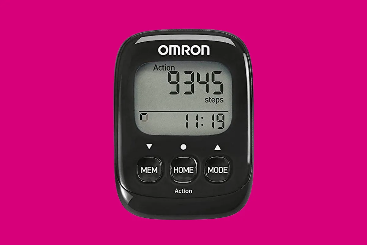 OMRON pedometer on a pink background