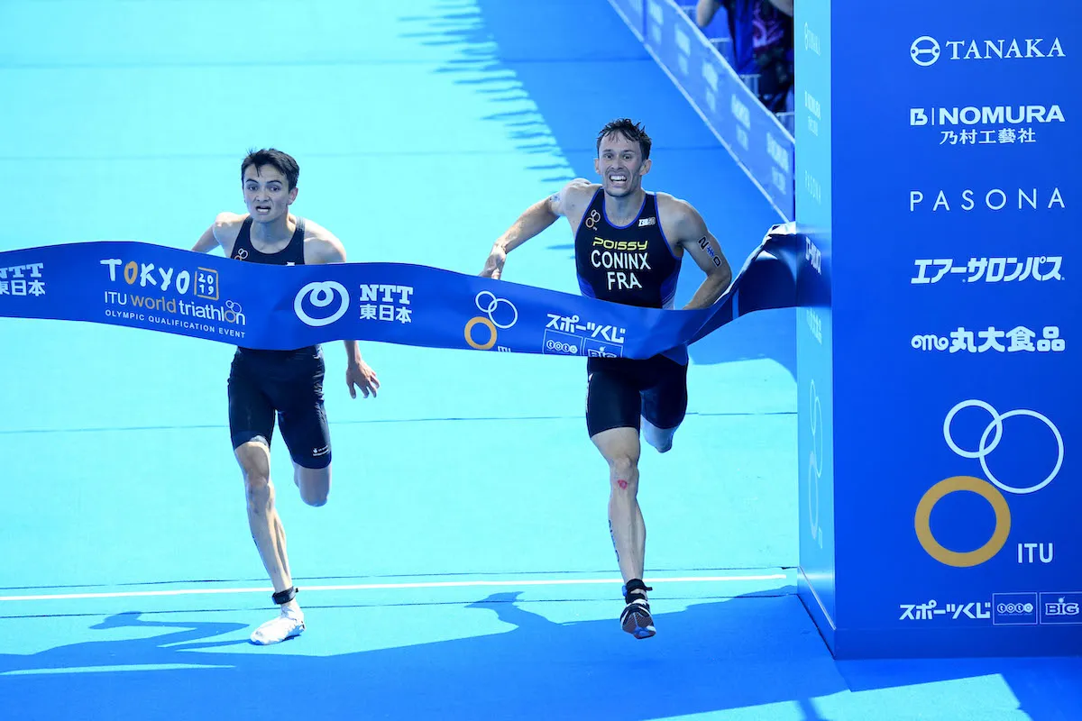 GB's Alex Yee and France's Dorian Coninx break the tape side by side at the 2019 Tokyo Olympics Mixed Relay Test Event