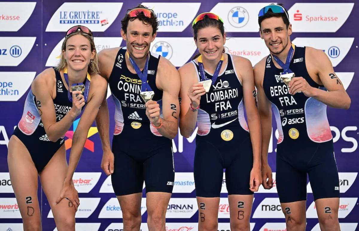 L-R: Cassandre Beaugrand, Dorian Coninx, Emma Lombardi and Leo Bergere hold their gold medals to the camera on top of the podium at the 2022 European Champs, in Munich, Germany