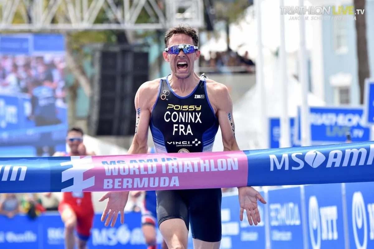 Dorian Coninx runs up to the finisher's tape with mouth open wide in triumph having won his first World Triathlon Series race in Bermuda, 2019