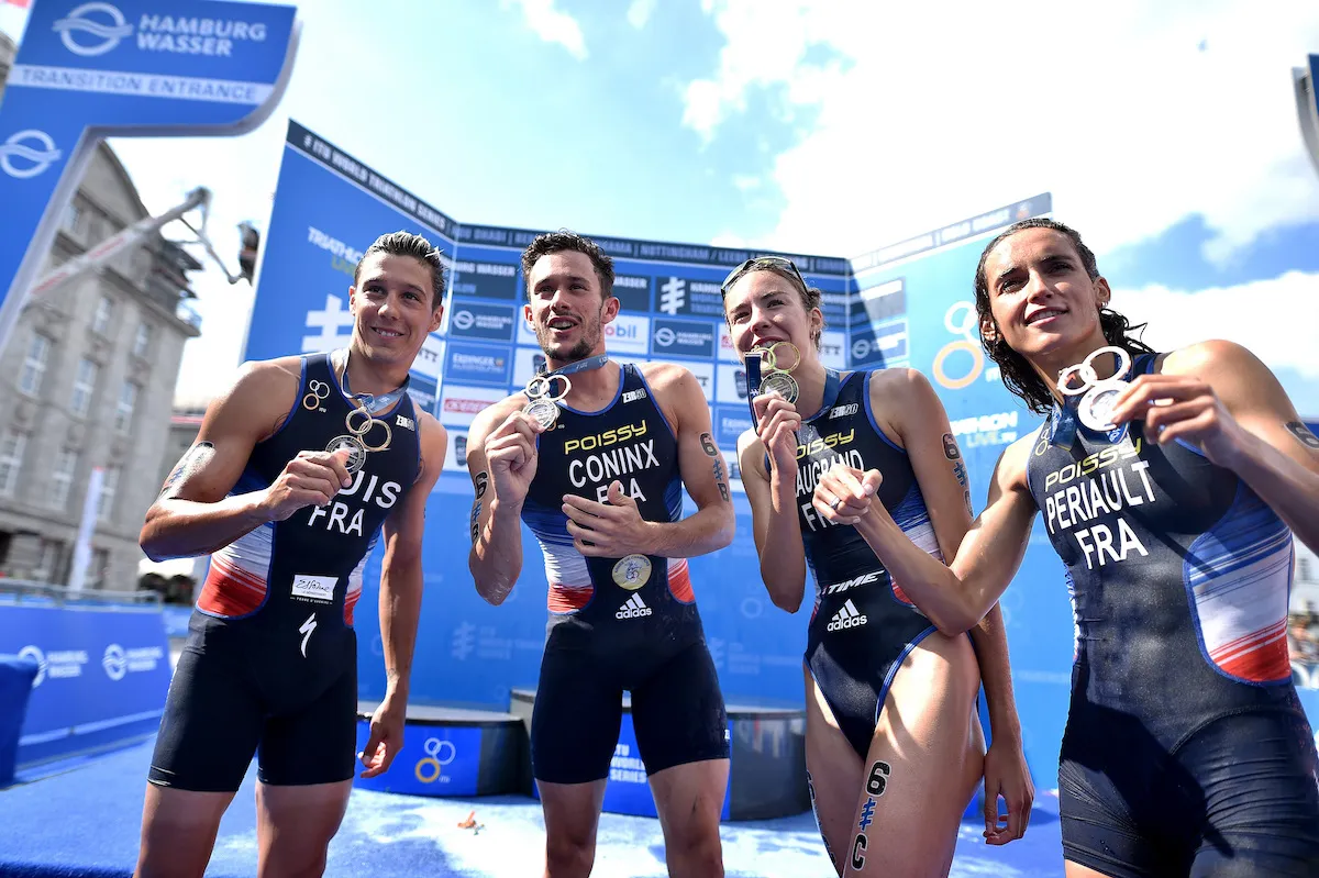 L-R: Vincent Luis, Dorian Coninx, Cassandre Beaugrand and Léonie Périault celebrate winning the 2018 Mixed Team Relay World Champs in Hamburg