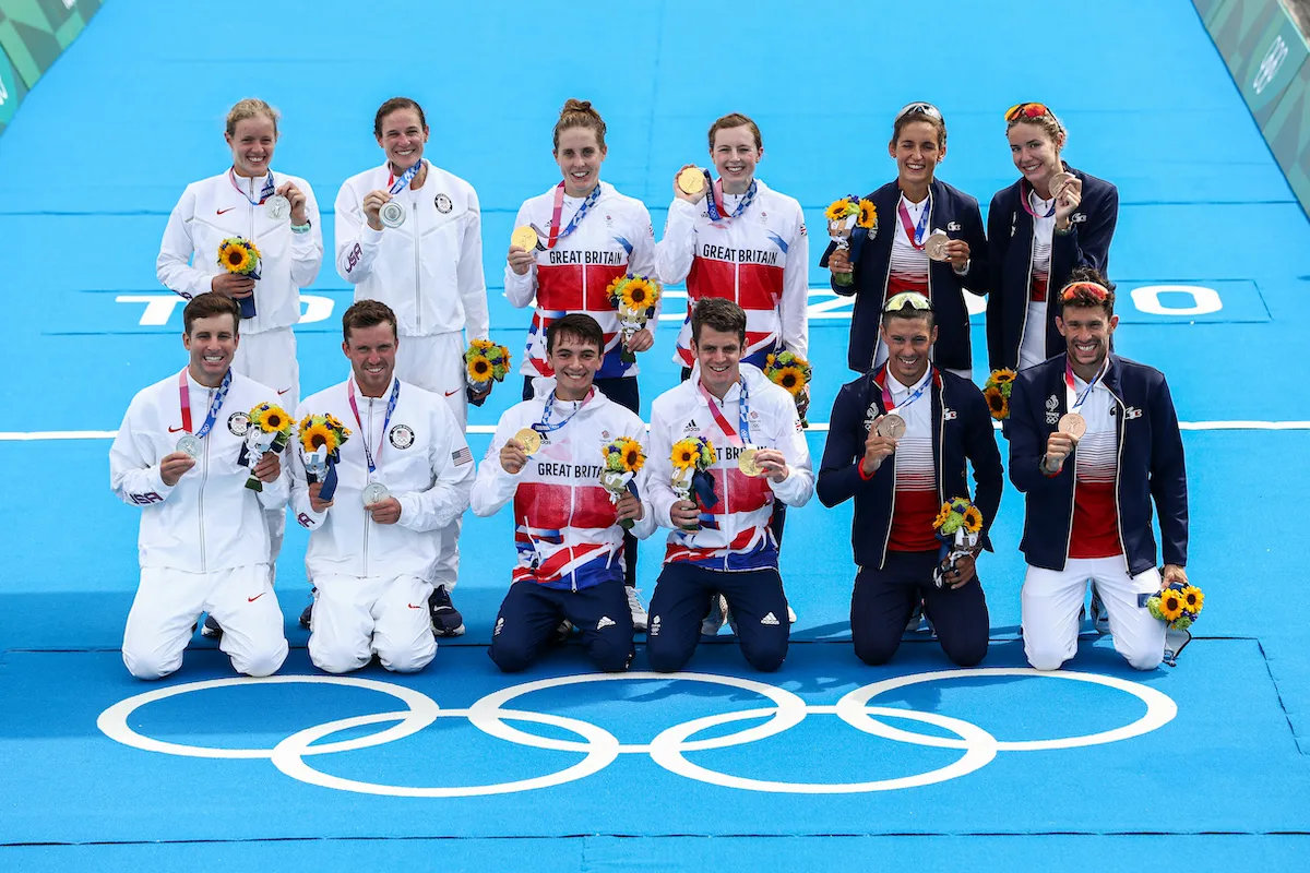L-R: The US (silver), GB (gold) and French (bronze) teams pose with their medals after the 2020 Tokyo Olympics Mixed Team Relay event
