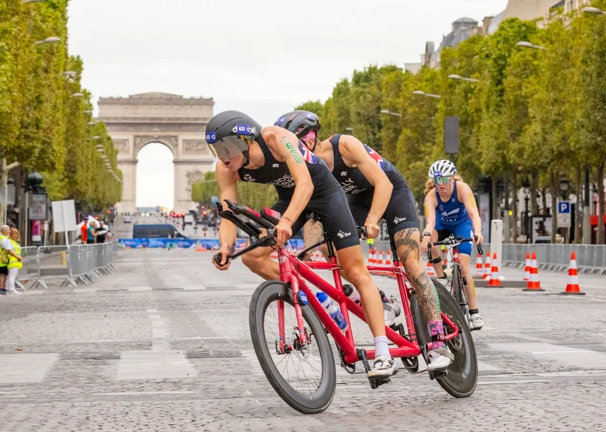 GB PTV1 paratriathlete Oscar Kelly and guide Charlie Harding race over the hallowed cobbles of the Champs-Élysées at the Paris Paralympics Test Event