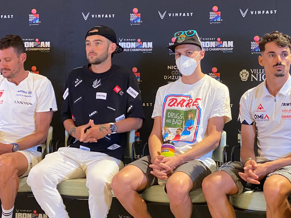 Leon Chevalier wears a Drugs Are Bad t-shirt at the pre-race Ironman World Championship press conference