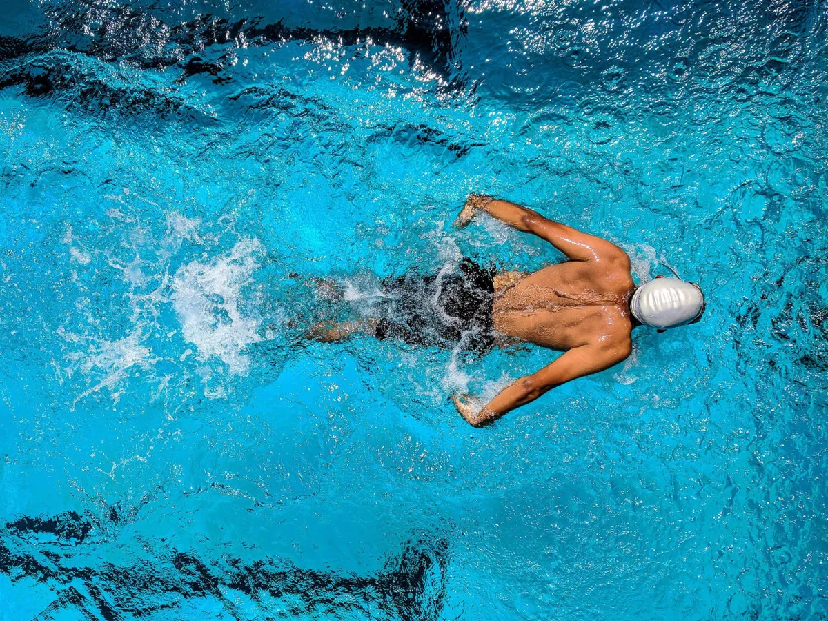 Man swimming in a pool