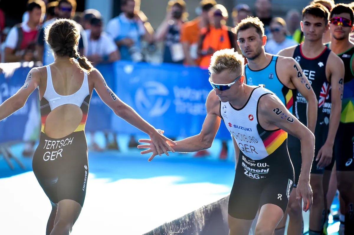 Germany's Lisa Tertsch tags teammate Jonas Schomburg at the Paris Mixed Team Relay Test Event, 2023