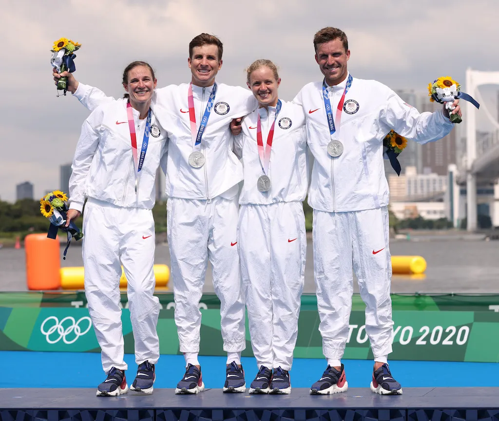 (L-R) Katie Zaferes, Kevin McDowell, Taylor Knibb and Morgan Pearson of Team United States pose with their mixed relay silver medals on the podium at the 2020 Tokyo Olympic Games