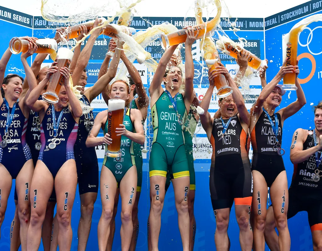 L-R: Team USA (silver), Team Australia (gold) and Team Netherlands (bronze) celebrate on the podium at the 2017 ITU World Triathlon Championships in Hamburg, Germany. 