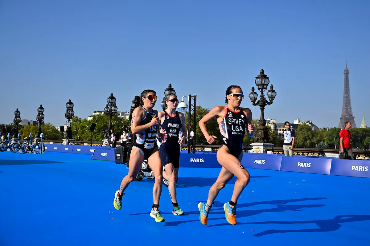 Jeanne Lehair of Luxembourg, Kate Waugh of Great Britain and Taylor Spivey of the US compete on Pont Alexandre III at the 2023 Paris triathlon test event