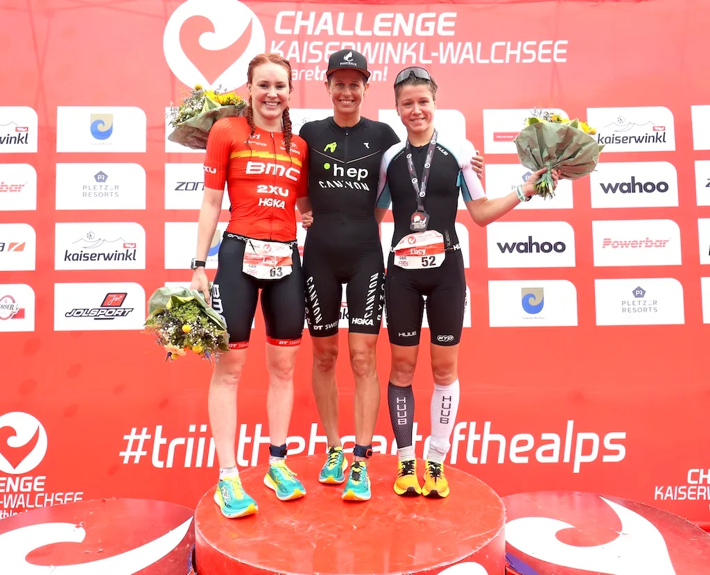 L-R: Lucy Buckingham (silver), Imogen Simmonds (gold) and Lucy Byram (bronze) on the podium of Challenge Walchsee in 2023