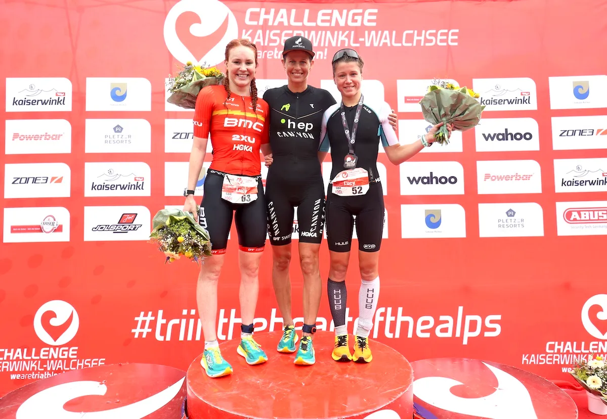 L-R: Lucy Buckingham (silver), Imogen Simmonds (gold) and Lucy Byram (bronze) on the podium of Challenge Walchsee in 2023