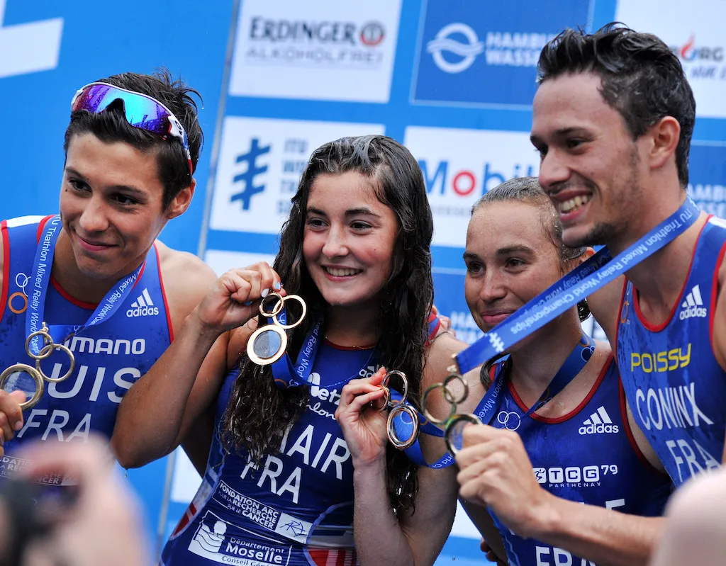 The French mixed relay team pose with their gold medals after winning the 2015 Mixed relay World Champs in Hamburg, Germany