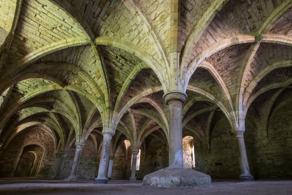 stone arches at the Undercroft at Battle Abbey in East Sussex