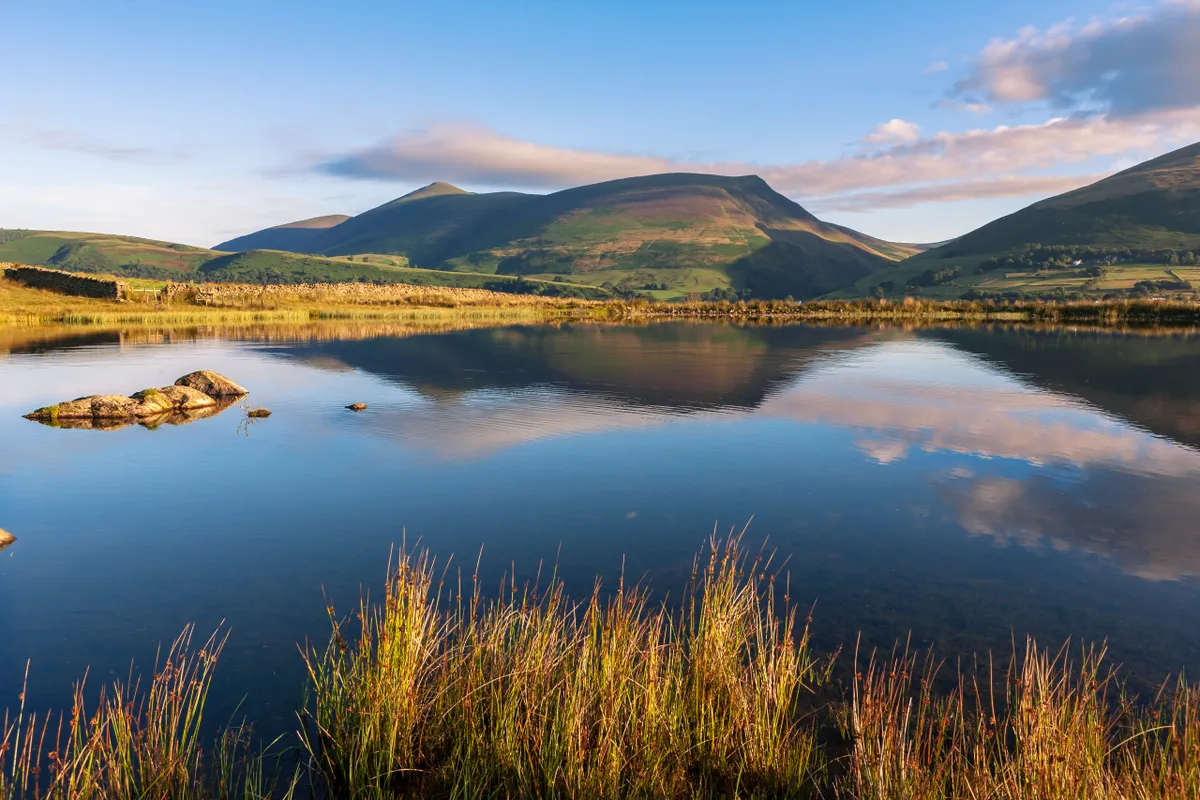 Tewet Tarn and beyond, across the Greta Valley, Lonscale Fell and Skiddaw, near Keswick, Lake District, Cumbria, Getty