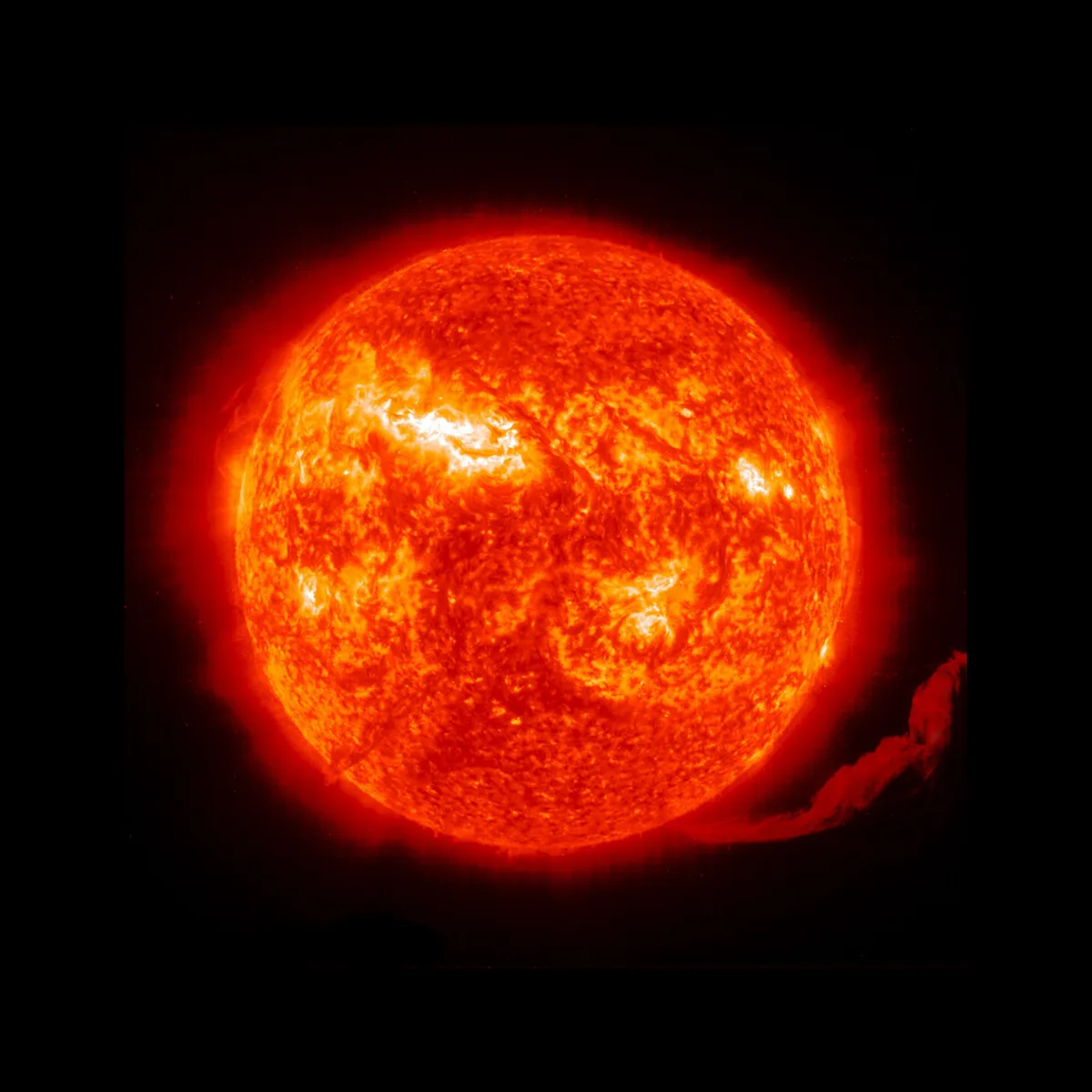 A solar eruption expels material from the surface of the sun.