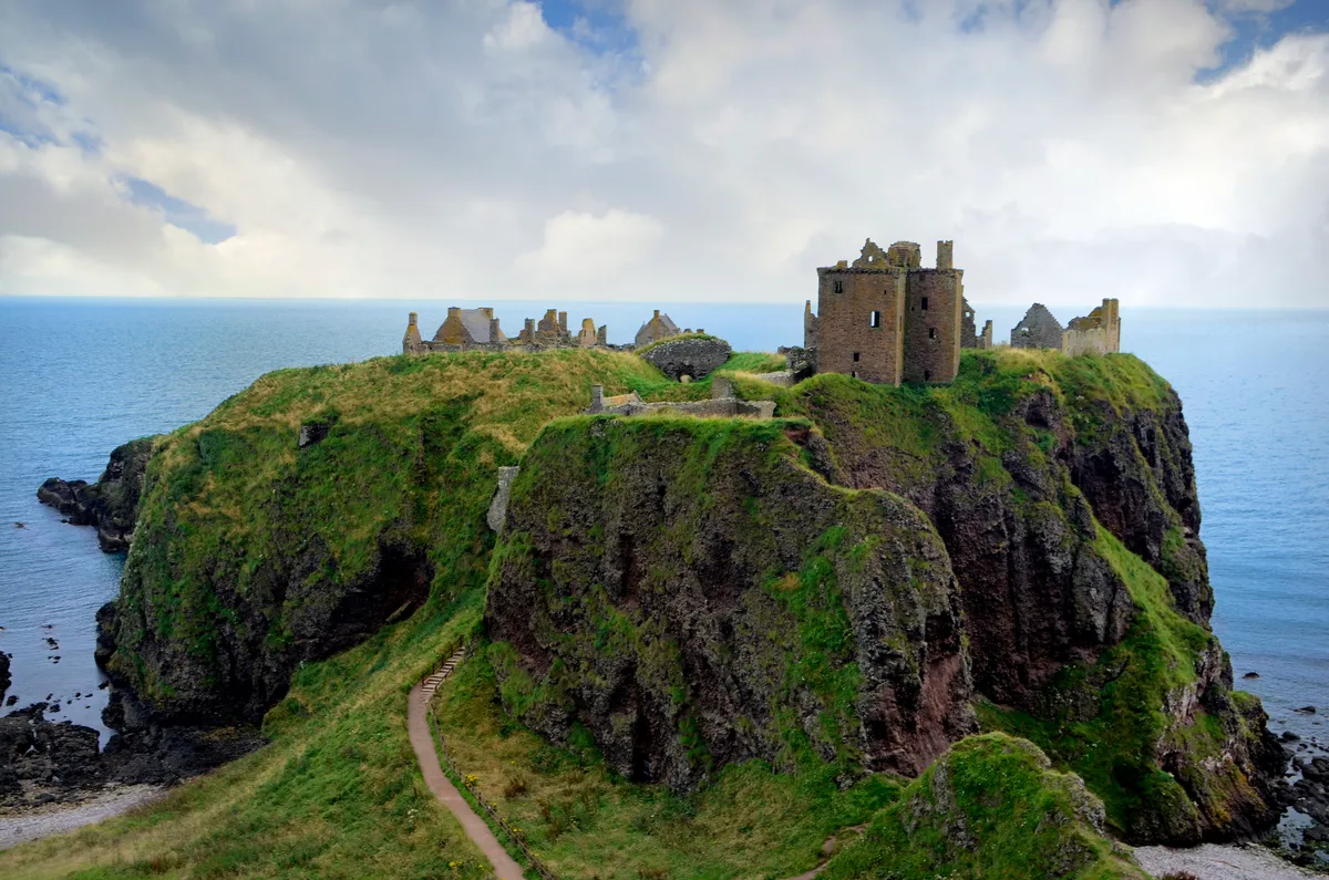 Dunnottar Castle is a ruined medieval fortress located upon a rocky headland on the north east coast of Scotland, about two miles (3 km) south of Stonehaven. The surviving buildings are largely of the 15th 16th centuries, but the site is believed to have been an early fortress of the Dark Ages.