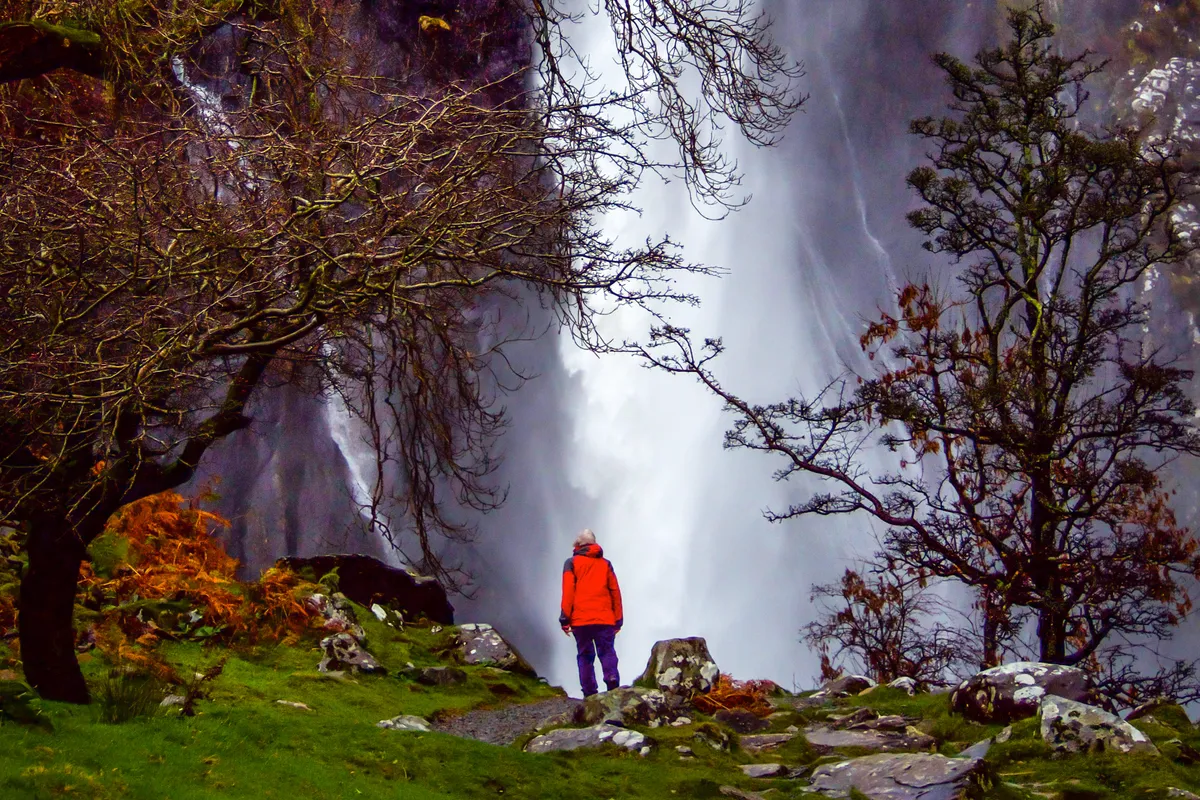 Person and waterfall