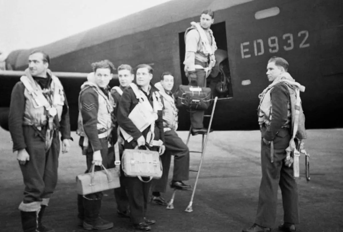 D50T0J Wing Commander Guy Gibson (in door of aircarft) and his crew board their Avro Lancaster bomber for No. 617 Squadron's raid on th