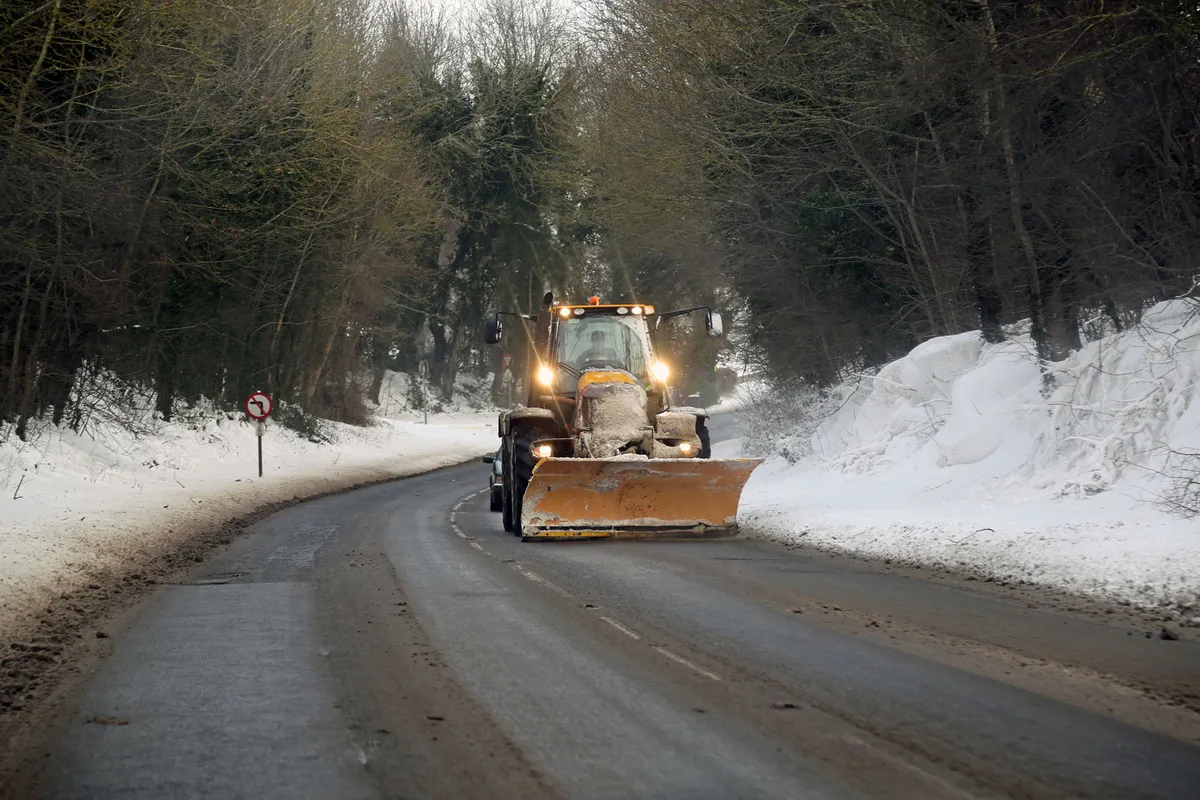 A tractor fitted with a front snow-plough, helps to clear snow on the A606 Stamford Road at Empingham in Rutland, between Stamford and Oakham, during the 'Beast from the East' bout of cold weather that hit Britain during late February/early March 2018/Credit: Getty