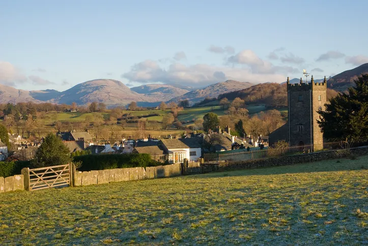 Hawkshead village in the English Lake District on a frosty winters morning with the fells in the background.
