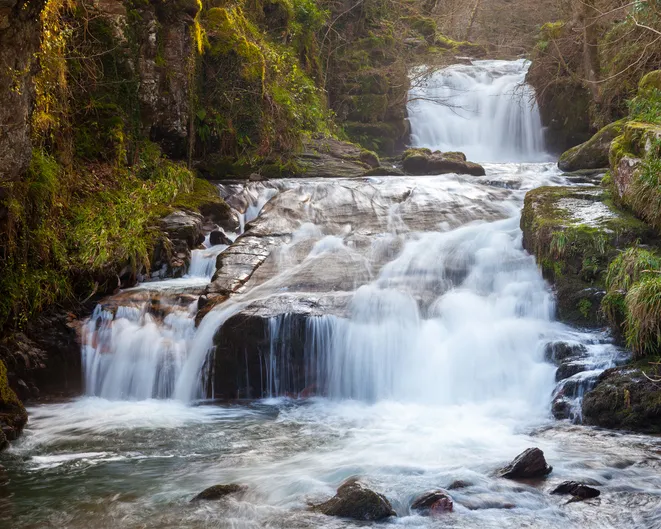 Watersmeet Falls, where the East Lyn River and Hoar Oak Water converge, Devon England UK